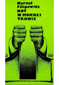 Kot w mokrej trawie
